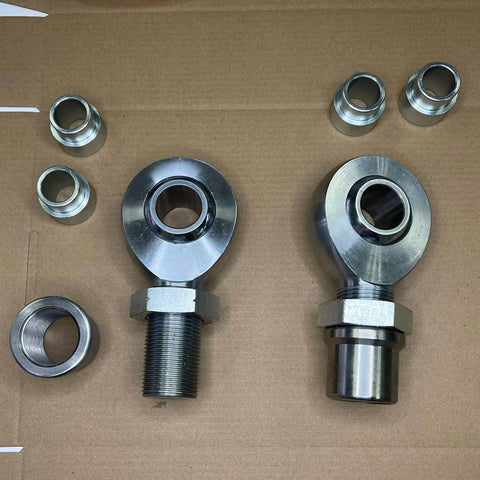 2 pair 1.25 inch Heim Joint Rod End Kit, chromoly rod ends, heat treated, chrome plated with tube adapters and spacers on cardboard.