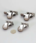 1 Inch Low Profile Swivel Caster Wheels 4 Pack with soft rubber, showing 360 degree top plate and locking mechanism next to a coin for scale.