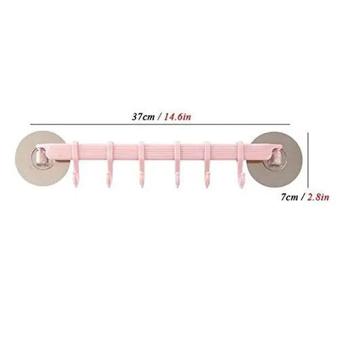 No Drill Hassle Self Adhesive Towel Rack Wall Mount Hook With Hella Strong Grip For Bathroom Kitchen And Living Room Totally Rad Space Saving Storage Solution Smooth Finish in pink with six hanging hooks.