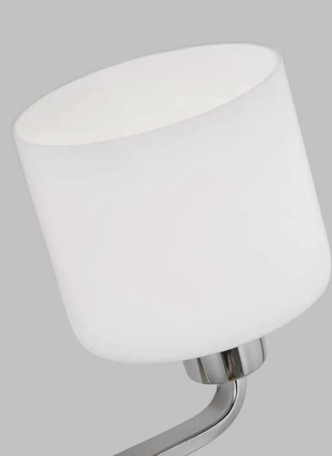 Close-up of etched white glass shade from Canfield Three Light Wall Bath Vanity Fixture in Brushed Nickel Finish