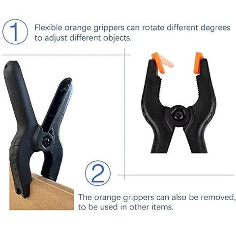 Front view of plastic spring clamps, 4.5 in, black with orange tips; 10-pack for crafts and backdrops