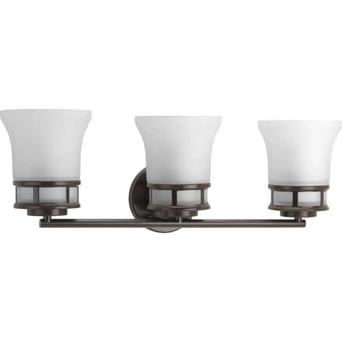 3 Light Coastal Style Bathroom Vanity Light With Dope Etched White Glass Shades Reversible Mounting Antique Bronze Finish Cascadia Collection Over The Mirror Bath Fixture