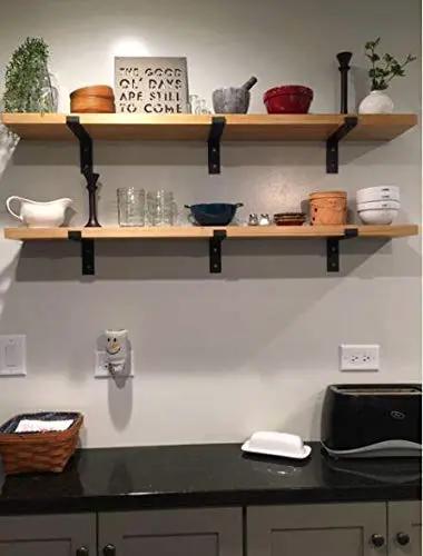 Heavy Duty Industrial Floating Shelf Wall Brackets For True 10 Inch Lumber Boards Built Like A Tank Forged Steel Bracket Set With 1 Inch Front Lip For Any Solid Home Makeover Project holding wooden shelves with various kitchen items.