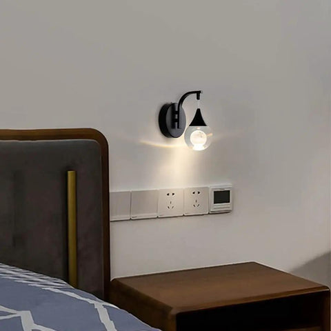 Moon Crystal LED Wall Sconce With Dimmable 5W Light modern matte black mounted above bedside table