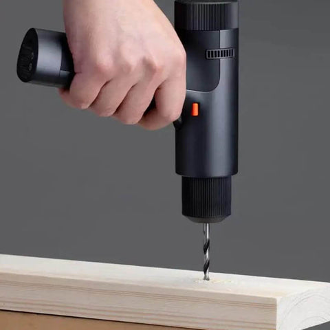 Badass Heavy Duty Brushless Cordless Drill And Screwdriver Workhorse Featuring Lightning Fast Type C Charging and Serious High Torque Output For Diy And Smart Home Projects drilling into wood.