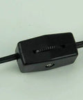 Close-up of black cord switch for Steampunk Industrial Fuel Dispenser Tower Table Lamp With Retro Machinery Vibe.