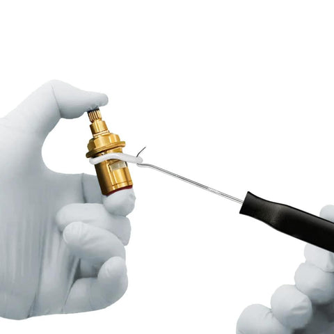 Using a pick and hook to remove a silicone O-ring from a pneumatic component, part of a silicone O-ring kit for pneumatic systems.