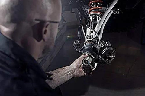 Person using Pro Build 35 Millimeter Wheel Bearing Grease Packer Made For Polaris Atv Utv And SxS on an ATV's drivetrain.