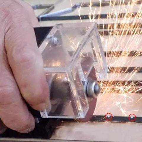 Hand using the Knockout Portable Pneumatic Nick Grinder that crushes hard grinding jobs smoothly at 30000 rpm with 50mm cutting wheel.