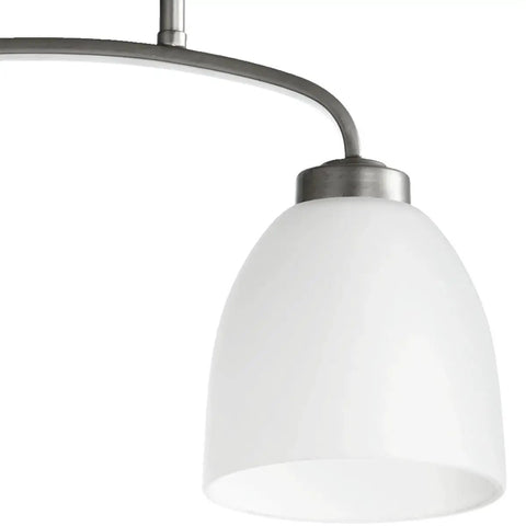 Close-up of Two Light Bathroom Flush Mount From Reyes Collection In Classic Nickel Finish, showing one light and curved arm design.