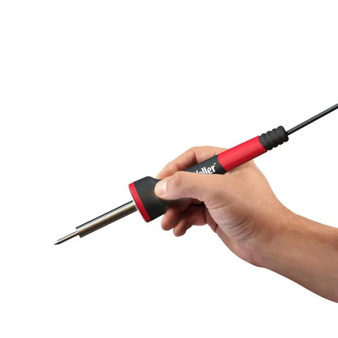 Hand holding the 5 To 30 Watt Precision Soldering Iron Station With Adjustable Wattage And Integrated Safety Rest In Compact 120V Design.