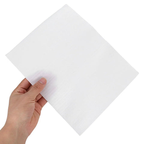 Hand holding white EPE foam pack from 100 Pack EPE Foam Pouches For Packing Dishes And Fragile Items Lightweight Cushioning Wrap Pouches Bulk Pack Protective Wrapping Bags For Shipping Supplies White.