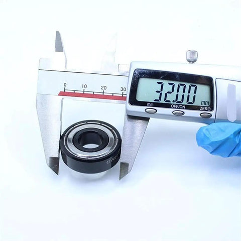 Top Shelf Tough As Nails High Temperature Bearing Repair Kit 6201ZZ Double Shielded Ball Bearing 12X32X10Mm Survives 500C Extreme Heat, measuring with calipers.