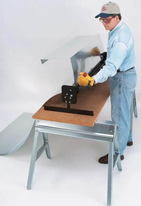 Worker using Portable Mini Metal Brake 48 Inch 22 Gauge Capacity Bends Up To 135 Degrees for bending roof flashing on job site