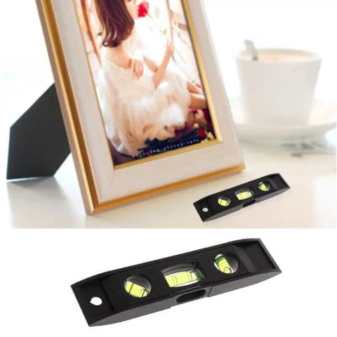 Dead On Accuracy Compact Magnetic Torpedo Level with crystal sight lines on a table, ideal for precise mounting.