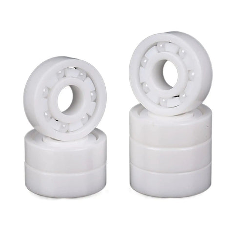 MR85 5X8X2.5MM Precision Sealed Ball Bearings stacked, white, ideal for heavy duty gear and bicycle wheels.