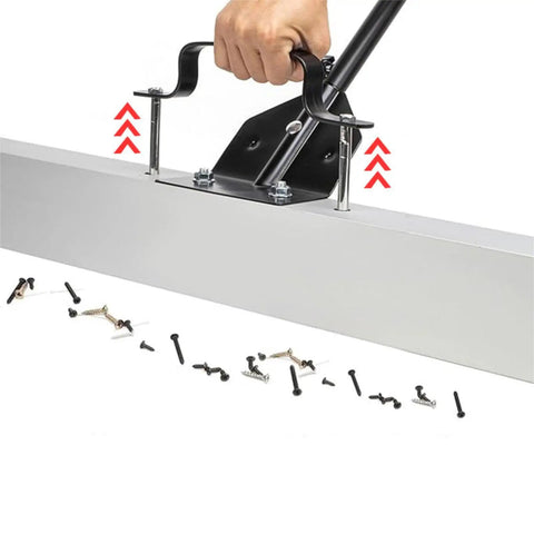 Hand using the 24 Inch Pick Up Sweeper With Sturdy Aluminum Alloy Handle For Workshop Iron Debris Collection, collecting screws.