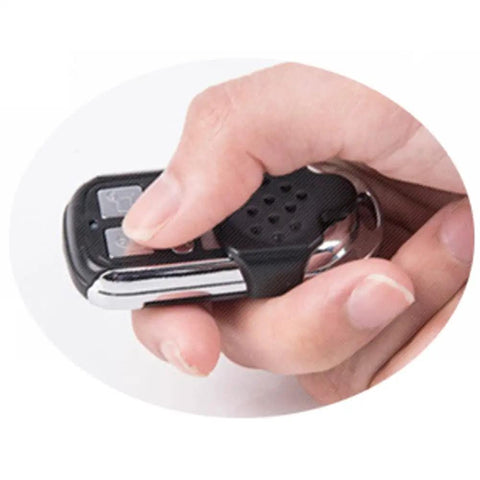 Person holding remote for Smart Wireless Anti Theft Door Lock Kit With Keyless Deadbolt Access Control System For Home Security