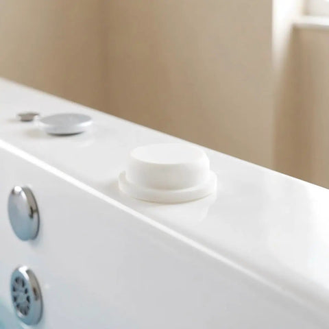 Silicone Bathtub Drain Plug Cover 5pcs for 30-31mm Bubble Openings installed in a bathtub, showing smooth white silicone finish.