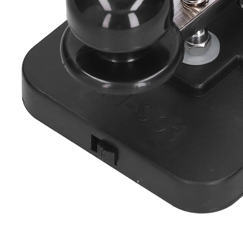 Close-up of Portable Morse Code Key And CW Practice Tool Telegraph Tapper with black ABS base and iron elements for beginners.