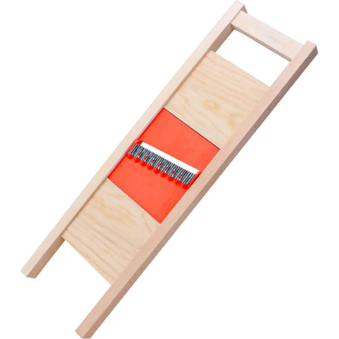 Wave Waffle Crinkle Cutter with stainless steel blade and orange base in wooden frame