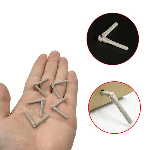Five Pack Plastic RC Pin Hinges For Planes And Helicopters Two And A Half Millimeter By Forty Three Millimeter Gray held in hand