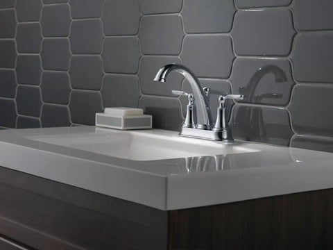 Woodhurst Centerset Chrome Two-Handle Bathroom Faucet for Modern Sinks with Push-Pop Drain Assembly in sleek bathroom