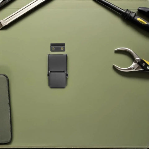 Heavy Duty Black Stainless Steel Concealed Toggle Latches For Toolbox And Suitcase With Weather Resistant Protection and Sturdy Metal Draw Buckle Closure That Holds Tight During Rough Use on a work surface with tools.