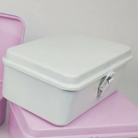 Heavy Duty Vintage White Metal Toolbox Featuring A Tight Snap Shut Locking Latch Tin Storage Case on a pink surface.