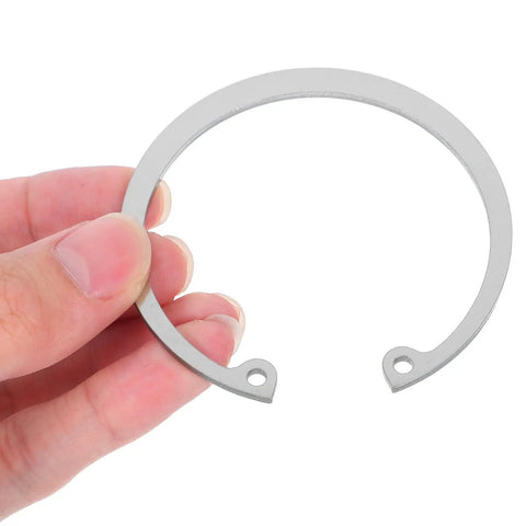 Close-up of a C-shaped ring from Five Piece Stainless Steel Retaining Clips Internal Snap Rings Assortment Kit With C Shaped Elastic Design For Studs And Pins Versatile Use Durable Silver Finish Easy Install And Quick Removal For DIY Automotive And Workshop Projects, silver finish, hand holding.