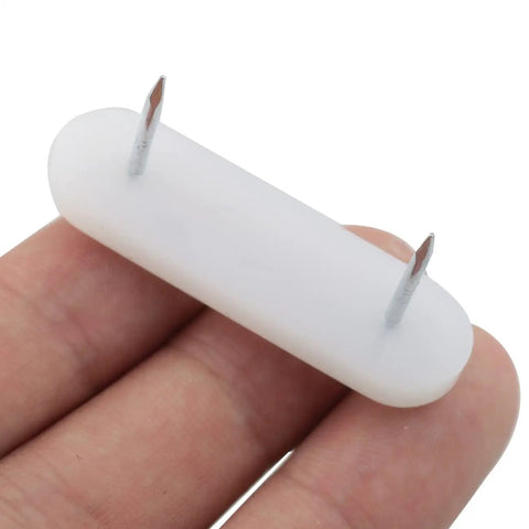 Close-up of 50 Pack Nail On Chair Sliders With Plastic Head For Hardwood Floors, PTFE Thick Pad Floor Protectors, Double Needle Pins