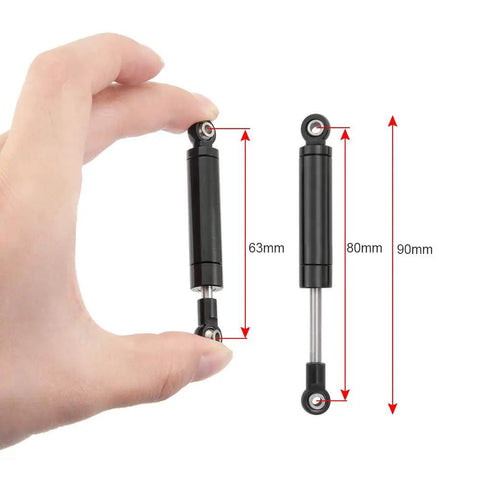 Hand holding Beefy Metal RC Shock Absorber Damper 80mm with Internal Spring for One Tenth Scale RC Crawlers