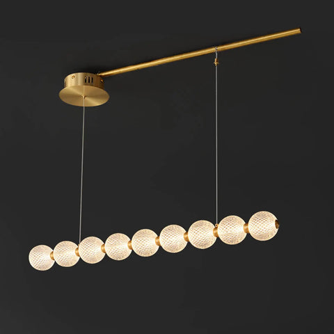 Modern Minimalist Nine Light Brass Pendant Light With Sleek Magic Bean Profile delivering lowkey stunning vibes, featuring round textured bulbs.