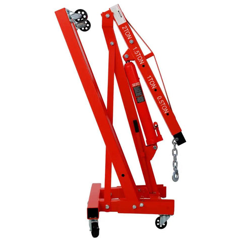 Heavy Duty Garage Ready 2 Ton Folding Engine Hoist And Cherry Picker Shop Crane Built Like A Tank With Sweet Rolling Six Iron Caster Wheels For Workshop Lifting Jobs In Bold Red side view showing hydraulic mechanism and caster wheels.