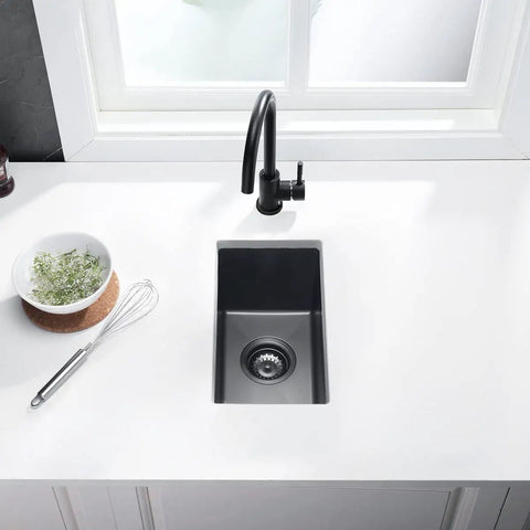 Stainless Steel Single Bowl Bar Sink Undermount Prep Sink With Strainer And Waste Basket For Small Spaces Black 10 By 17 By Eight And A Half Inches Durable Finish installed in kitchen countertop, overhead view.