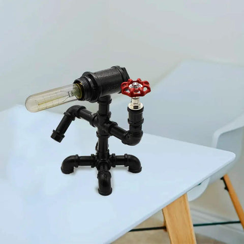 Industrial desk lamp made from black metal pipes with red valve handle, showcasing DIY design using 6 Pack Half Inch Steel Pipes Four Inch Long.