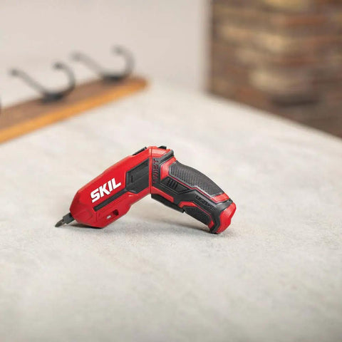 Pivot Grip 4V Rechargeable Cordless Screwdriver With 9 Bits, red handle design on a countertop