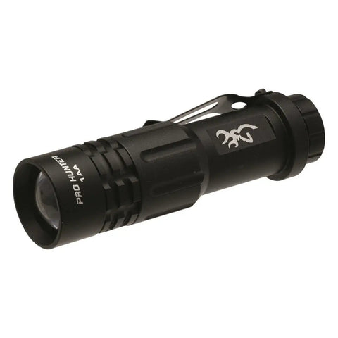 Compact black flashlight from Outdoorsman Survival Combo Knife kit, with adjustable beam and clip, shown at an angle