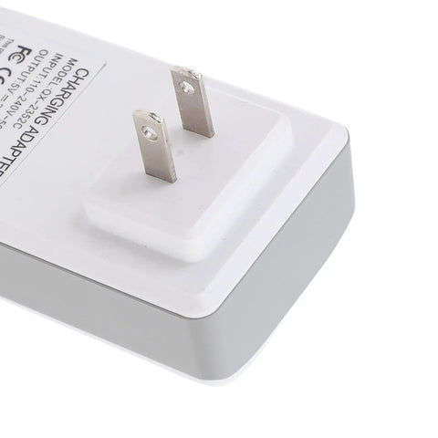 Top Tier Portable Ups Adapter With 1200mAh Emergency Backup For Router Camera Modem 2A Usb Output Flame Retardant Shell close-up view of prongs.