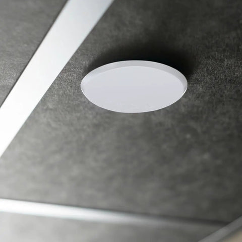 Slick Fit Galvanized Steel Recessed Fire Sprinkler Cover Plates 4 Pack Flush Ceiling Trim Ring on gray ceiling surface.