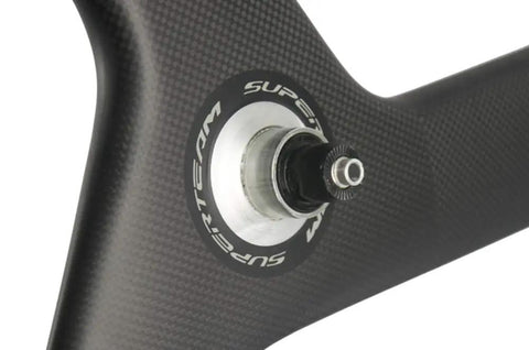Close-up of Carbon Fiber 56mm Clincher Wheel TriSpoke Wheelset For Road Bike With 3K Matte Finish showing Novatec hub detail.