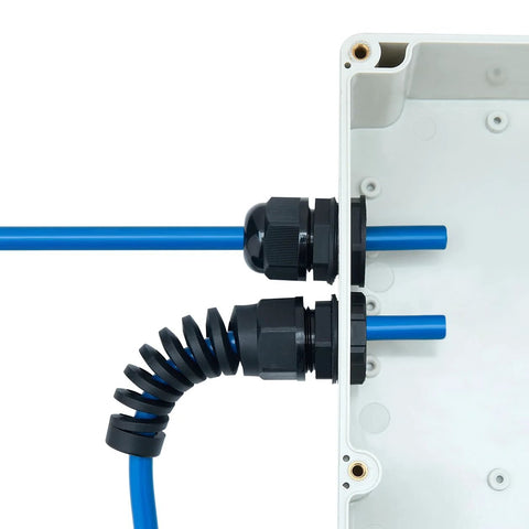 Waterproof cable gland with PG7 thread installed in electrical box; black PA66 plastic, blue cables.