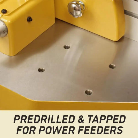 Rock Solid Shop Beast Five Horsepower Spindle Shaper With Massive Cast Iron Bed showing predrilled holes for power feeders.