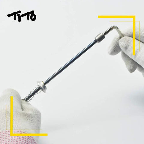 Ultra Lightweight Titanium Quick Release Skewers Set For Road And Mountain Bikes Front And Rear Disc Wheel Hubs 74 By 130 100 By 130 100 By 135 Millimeters 35 Grams Per Pair Disc Brake Compatible No Fuss Install held in gloves.