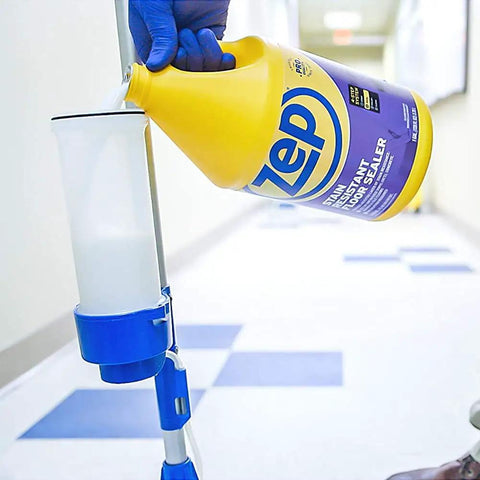 Pouring Zep stain resistant floor sealer into a dispenser, part of the Top Shelf Heavy Duty Floor Cleaning Kit With Stripper Sealer Polish And Cleaner Four Gallon Set Solid Setup For Kitchens And High Traffic Zones Level Up Your Daily Mopping Game.
