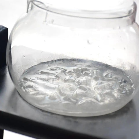 Close-up of a one liter glass vessel from the Premium Handmade Glass And Wooden Cold Brew Coffee Maker.