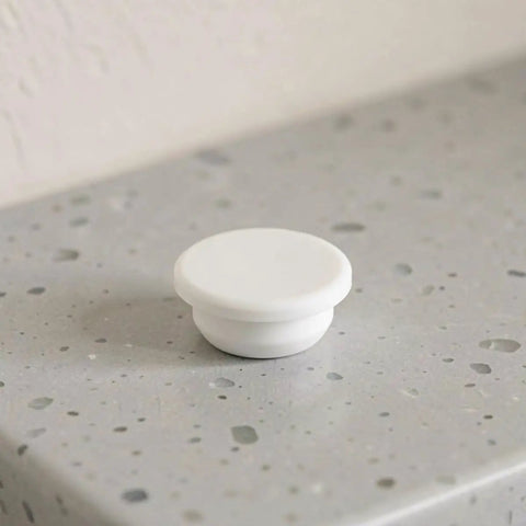 5pcs Bathtub Drain Stopper Cover for 30-31mm Round Holes, White sitting on a countertop with a smooth texture.