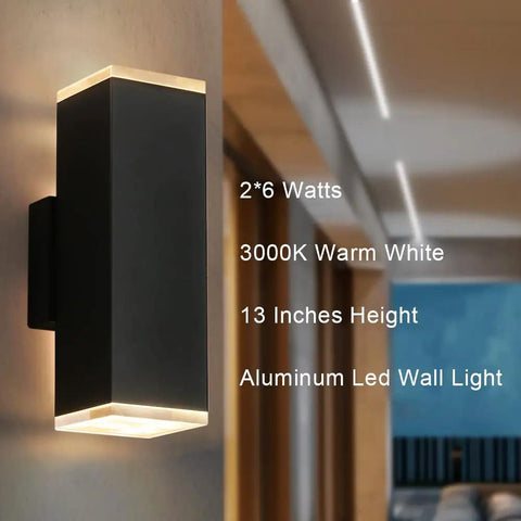 Black LED Modern Square Aluminum Outdoor Wall Light Fixture With Up Down Lighting 12W 3000K in a contemporary setting.