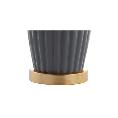Close-up of gray ceramic fluted base with brass accent from Gray 28.5 Inch Modern Ceramic Table Lamp With Fluted Base And White Linen Shade.