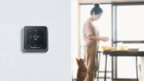 Smart Thermostat T5 Black ENERGY STAR Certified Cut Bills With Easy Temperature Control on wall with blurred background